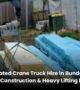 Top-rated crane truck hire in Bundamba QLD lifting heavy construction materials safely on site